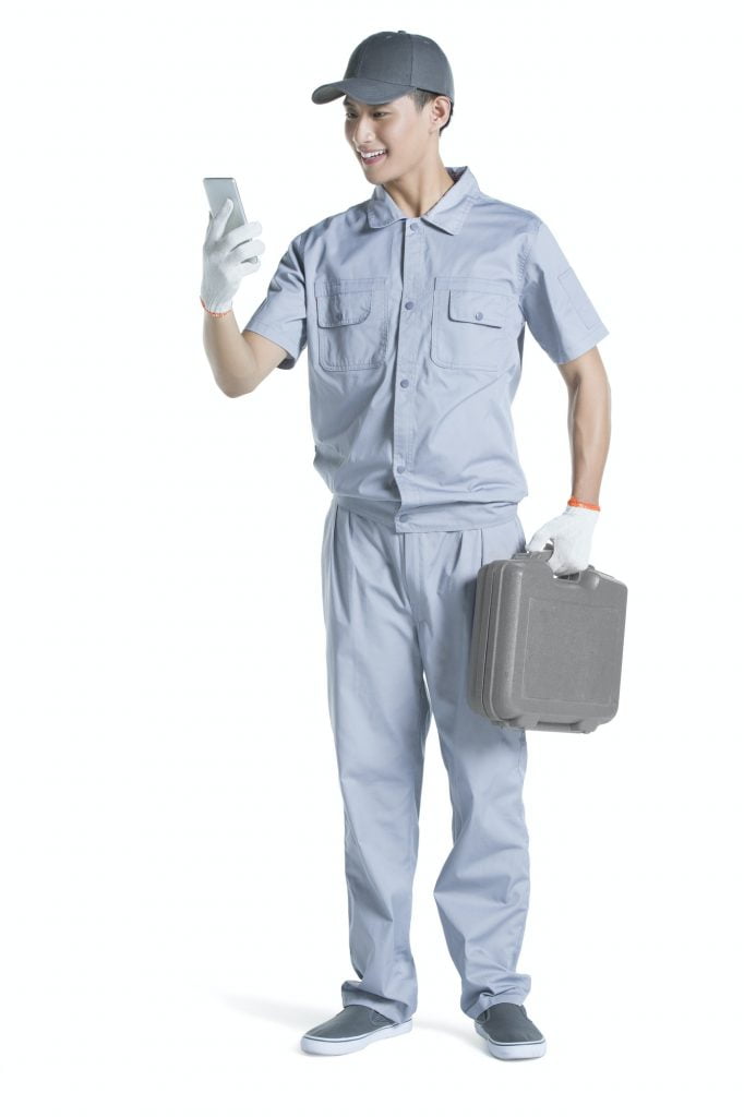 Repairman using smart phone