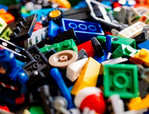 Valencia, spain - february 9, 2022: messy Lego pieces on the floor, detail.